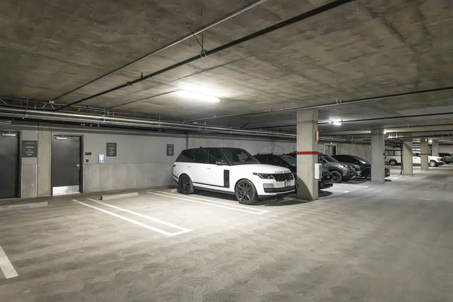 55_garage Covered parking garage with resident parking spaces and vehicle access.