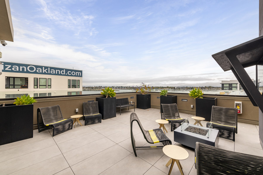 70_roof_terrace Rooftop terrace with outdoor lounge seating and waterfront views.