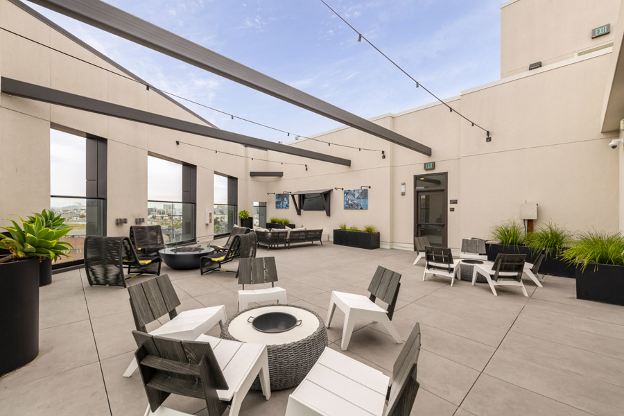 73_roof_terrace Shared rooftop terrace with lounge seating, fire pit, and outdoor gathering areas.