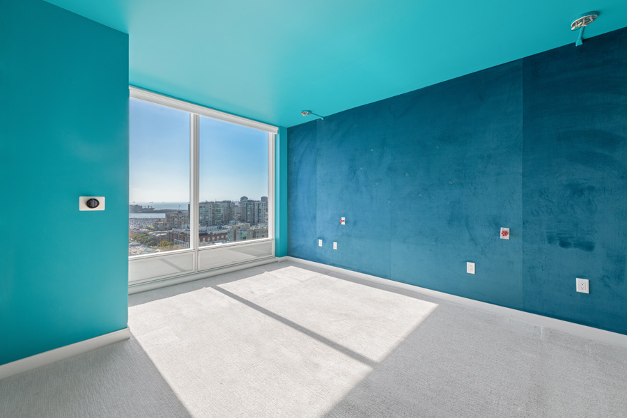 18_primary Primary bedroom with carpeting, floor-to-ceiling windows, and panoramic bay views.