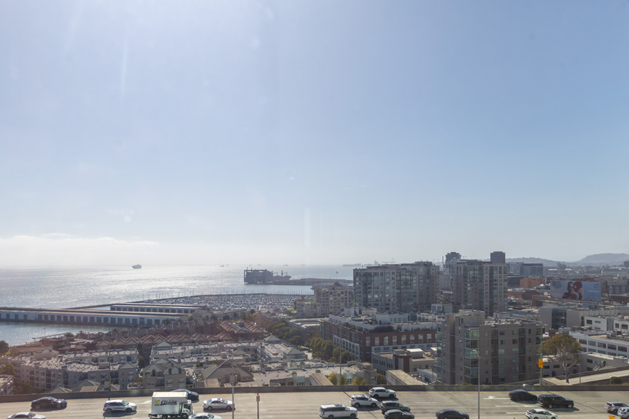 28_view Bay Bridge and waterfront view overlooking neighboring buildings and city streets.